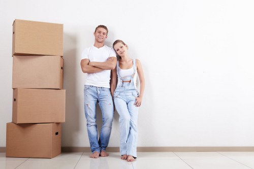 Removal team preparing flat removals in Stockwell with boxes and furniture