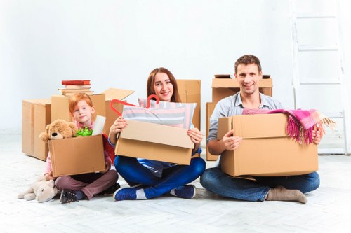 Packed office boxes and labelled furniture ready for relocation