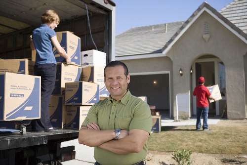 Local movers transporting items through a Stockwell street