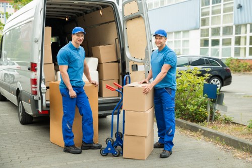 Student boxes, desk, and bedroom items arranged for transport in Stockwell