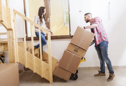 Careful loading of household items into a moving van